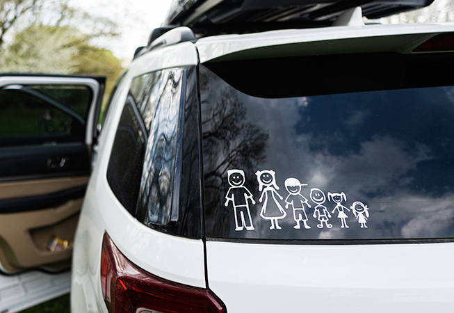 Rear car window with family decal